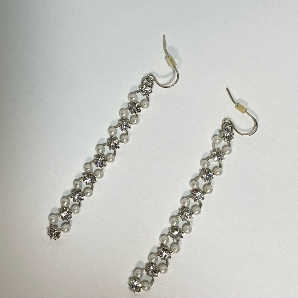 Silver tone women pearl and white rhinestone long drop earrings. Used.